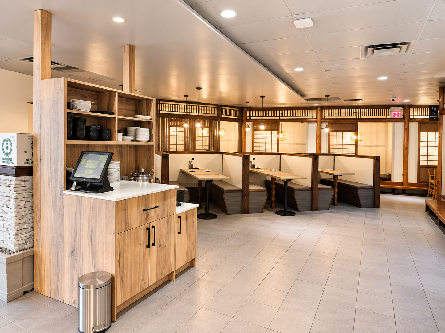 Dining booths and wood finishes inside Miu Sushi
